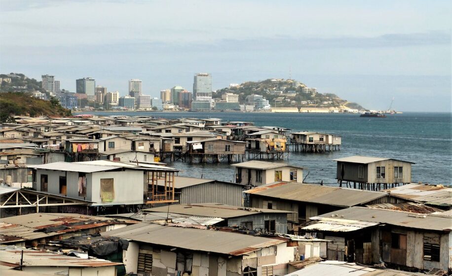 "Stilt Houses Port Moresby" by gailhampshire is licensed under CC BY 2.0. To view a copy of this license, visit https://creativecommons.org/licenses/by/2.0/